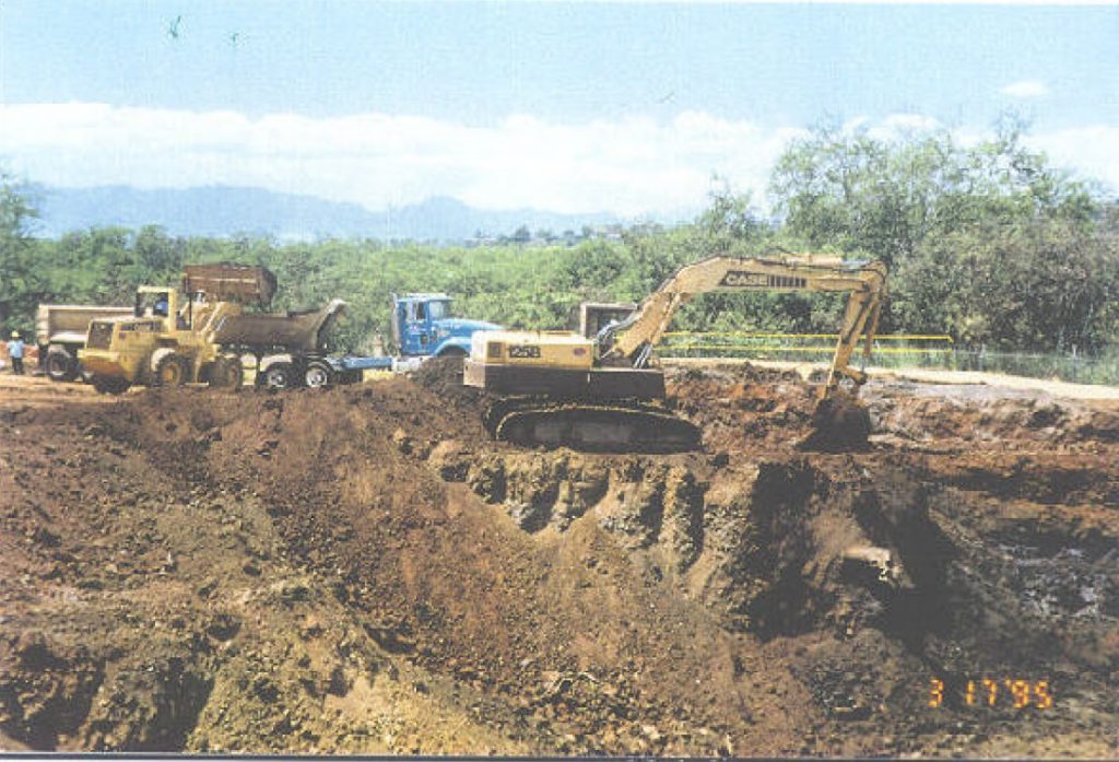 Excavating equipment digging up petroleum-contaminated soil during the Removal Action at the Former OWDF in 1995