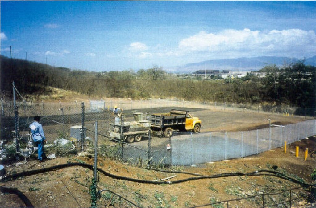 Hydroseeding equipment being used at the restored excavation area after backfilling with clean soil