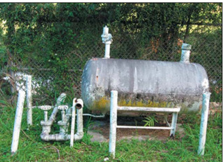 Am above-ground tank with piping.