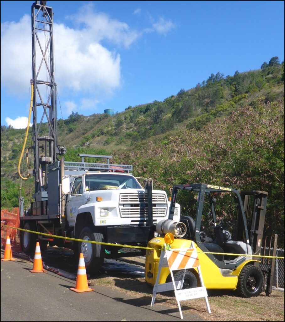 Drilling rig parked by the side of the raod.